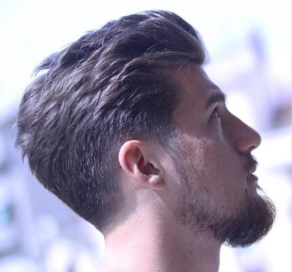 Textured Low Fade Slick Back haircut