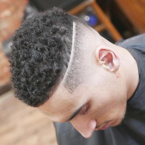 Spiky Curls With Deep Part and Fade